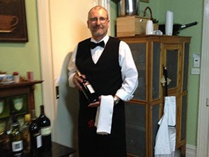 Martin serving wine at Mananga house Berry